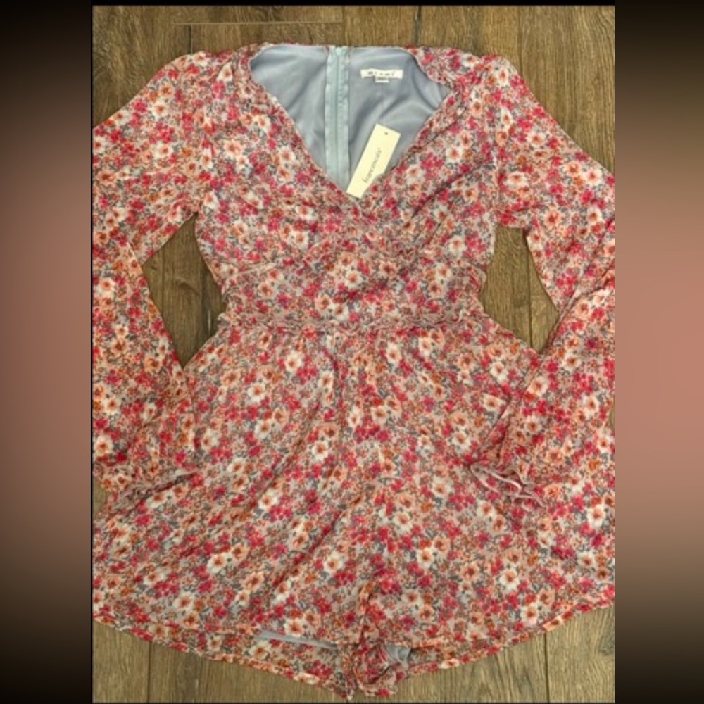 Brand New with tags attached Miami floral romper size XXS